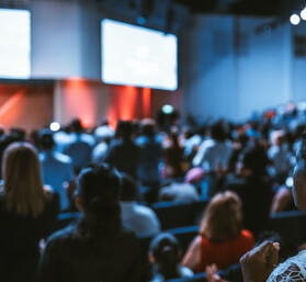 Conference members watching a presentation