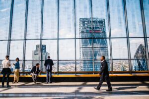 Mirrored Building with people walking